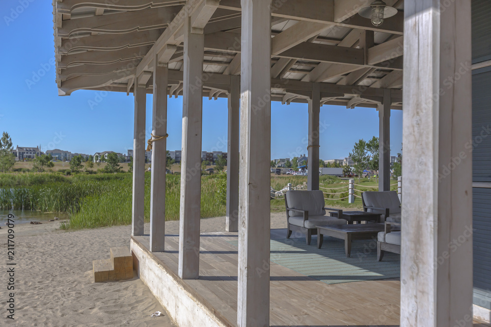 Clubhouse with seating area on the edge of lake Clubhouse with seating area on the edge of lake