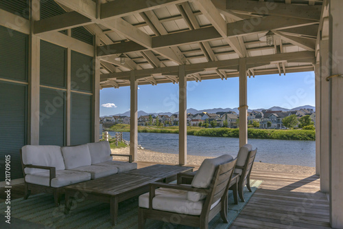 Clubhouse seating area with lake © Jason