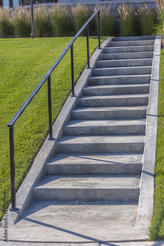 Fototapeta Naklejka Na Ścianę i Meble -  Concrete stairs in community area with lawn