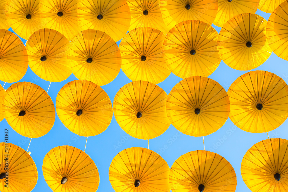 Pattern Yellow umbrellas on blue sky.