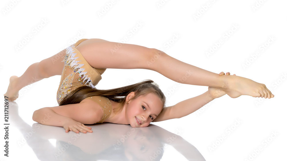 Naklejka premium The gymnast perform an acrobatic element on the floor.