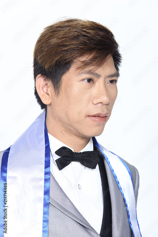Asian man after applying make up hair style. no retouch, fresh face Asian man after applying make up hair style. no retouch, fresh face