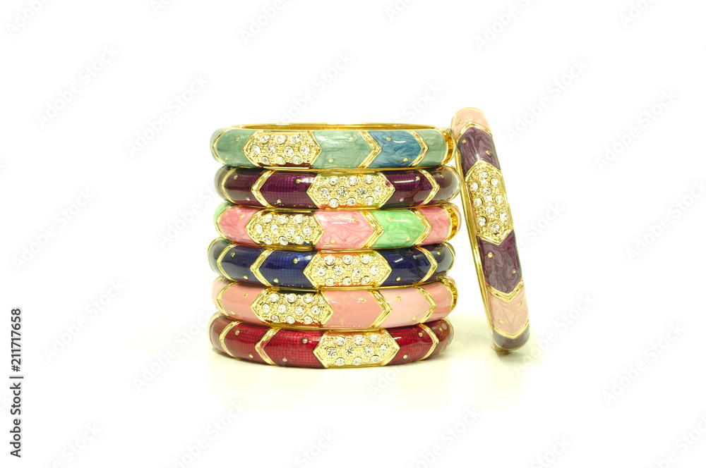 Stack of gold bangle with vivid color and rhinestone isolated on white background Stack of gold bangle with vivid color and rhinestone isolated on white background