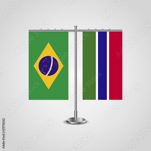 Table stand with flags of Brazil and Gambia.Two flag. Flag pole. Symbolizing the cooperation between the two countries. Table flags photo