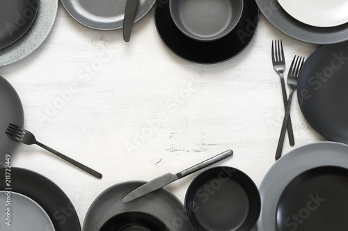 Monochrome tableware on white wood