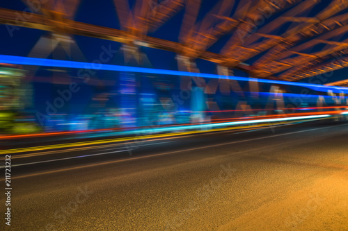 the light trails on the modern building background. © hallojulie