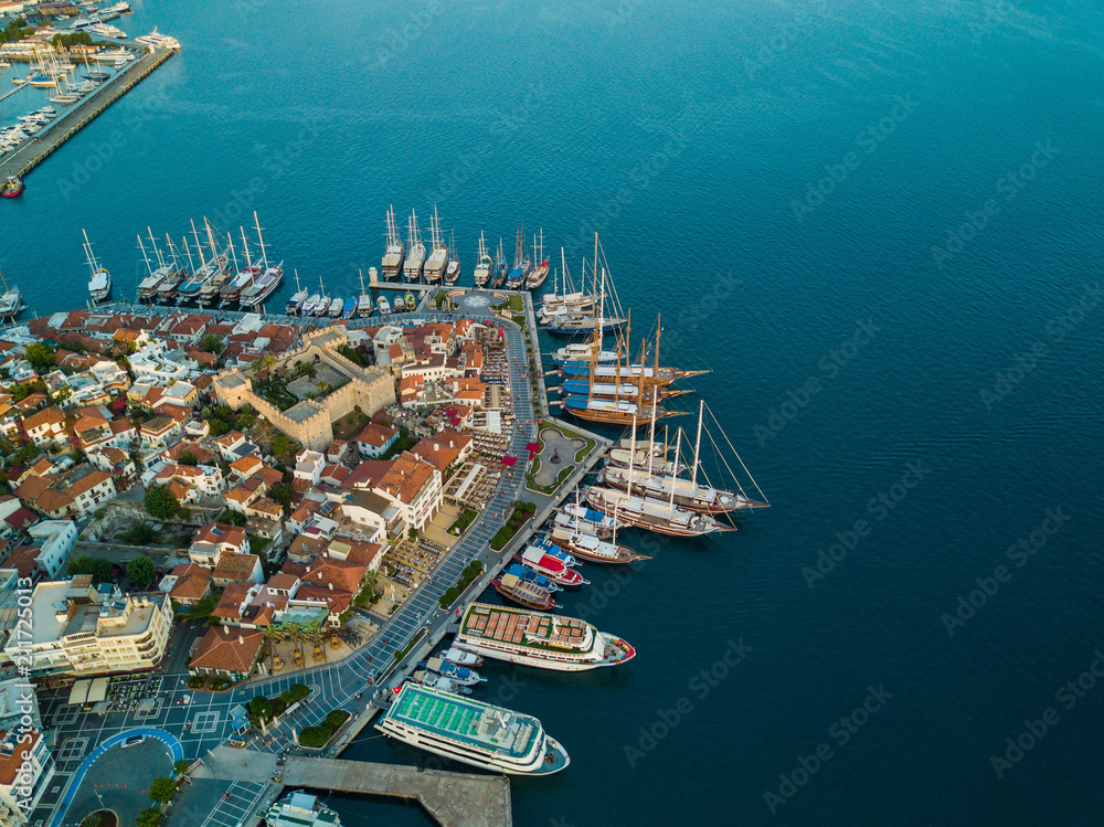 amazing aerial view of Marmaris Marina with lots of yacht and sailboat, old city center with a fortress in the center