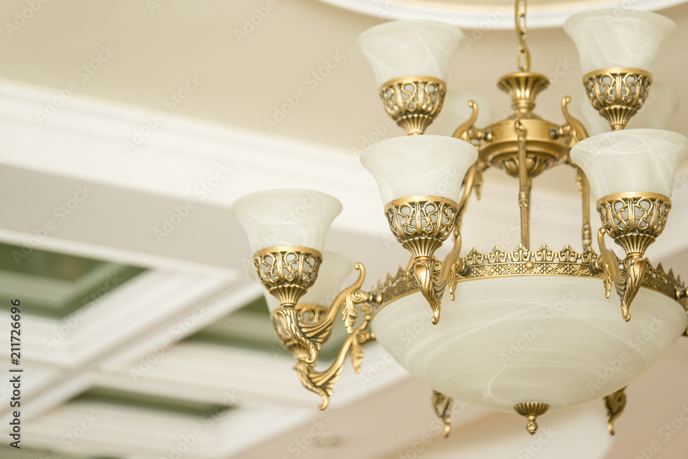 Vintage luxury chandelier in antique style in elegant interior closeup