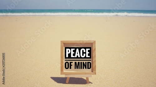 Motivational and inspirational quote - ‘Peace of mind’ written on a framed paper. With vintage styled background.