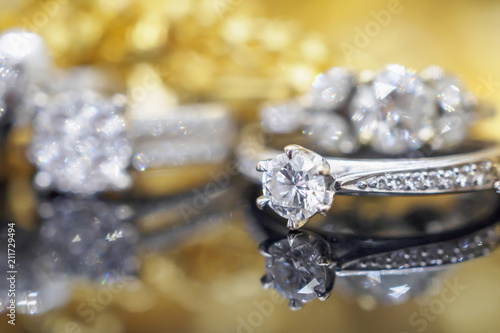 Luxury gold Jewelry diamond rings with reflection on black background