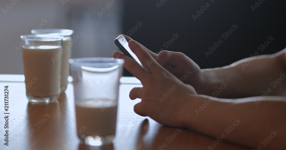 Man use of mobile phone in coffee shop at morning Man use of mobile phone in coffee shop at morning