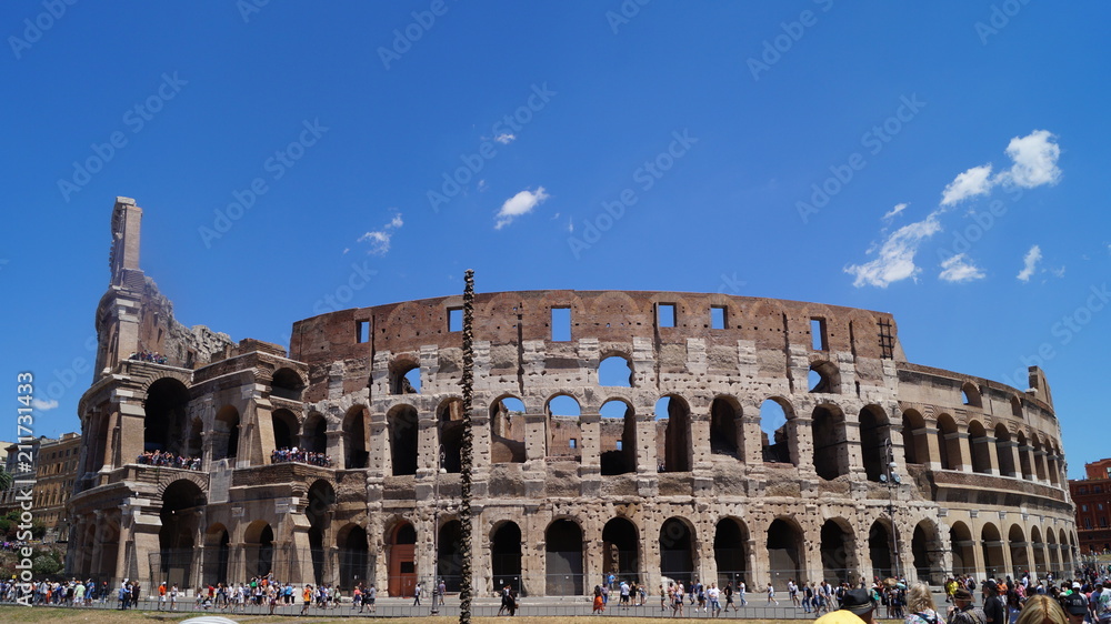 The Coliseum under the blue sky of Italy
