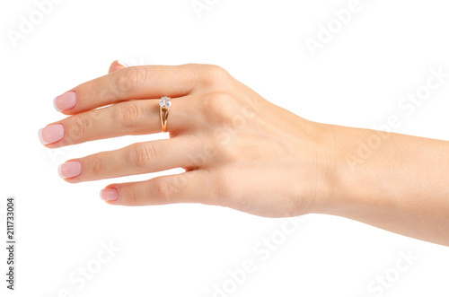 Female hand with a gold ring on a white background isolation