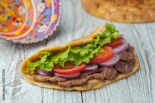 background,barbecue,beef,board,bottle,bread,cabbage,chicken,closeup,dinner,dish,donner,döner,fast,food,greek,green,grilled,gyro,hamburger,health,healthy food,kebab,kebap,lettuce,lunch,meal,meat,onion,