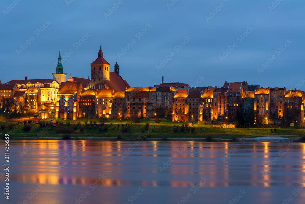 A view of Grudziadz at dusk reflected in Vistula river, Poland. Europe.