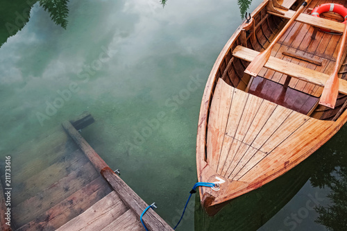 Wooden boat on the beautiful mountain lake,