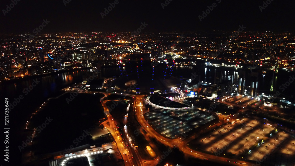 Fototapeta premium Aerial drone bird's eye view night shot of iconic O2 Arena as seen from Greenwich Peninsula, Isle of Dogs, London, United Kingdom