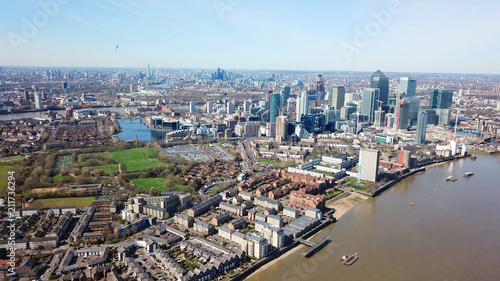 Aerial bird's eye view photo taken by drone of famous Docklands and Canary Wharf skyscraper complex, Isle of Dogs, London, United Kingdom