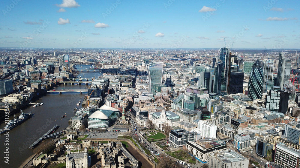Fototapeta premium Aerial drone bird's eye view of iconic skyline in City of London as seen from St Katharine Docks Marina, London, United Kingdom