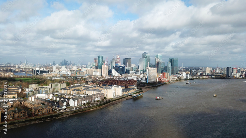 Naklejka premium Aerial bird's eye view photo taken by drone of famous Docklands and Canary Wharf skyscraper complex, Isle of Dogs, London, United Kingdom