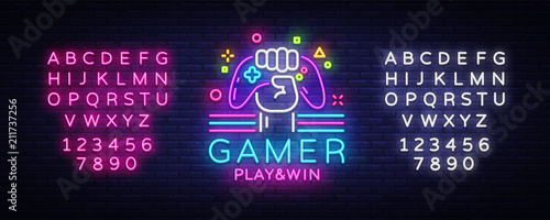 Gamer Play Win logo neon sign Vector logo design template. Game night logo in neon style, gamepad in hand, modern trend design, light banner, bright advertisement. Vector. Editing text neon sign photo