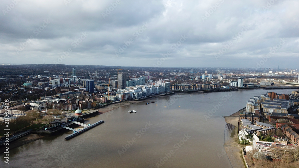 Aerial bird's eye view photo taken by drone of Greenwich village residential area by river Thames, London, United Kingdom