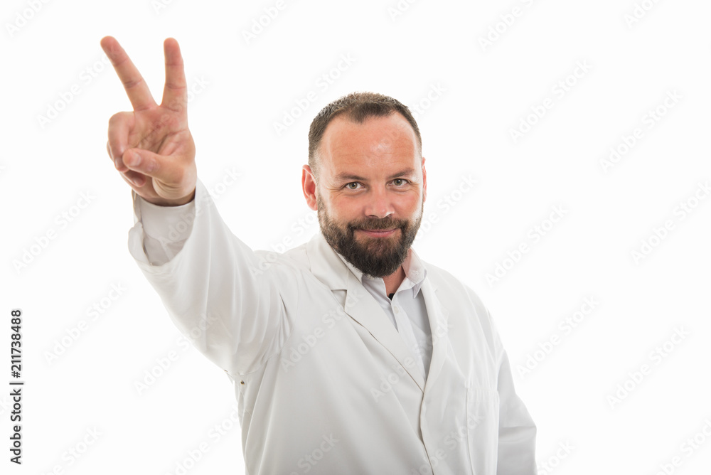Portrait of male doctor showing victory gesture Portrait of male doctor showing victory gesture
