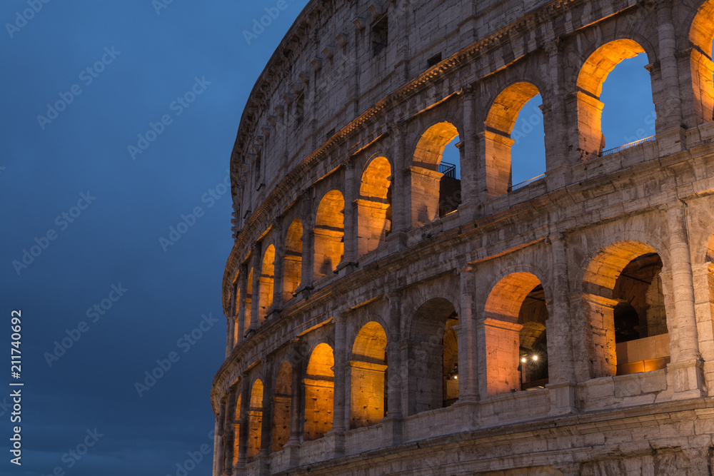 Roman Colosseum or Coliseum at dusk in Rome, Italy