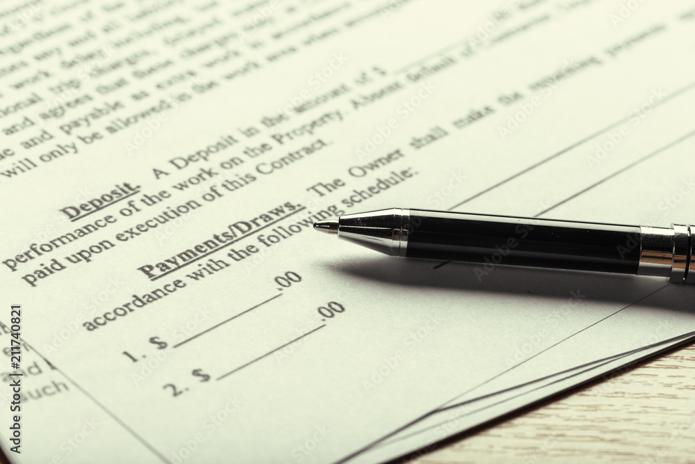 Close up shot of Eyeglasses on contract document papers business concept Close up shot of Eyeglasses on contract document papers business concept