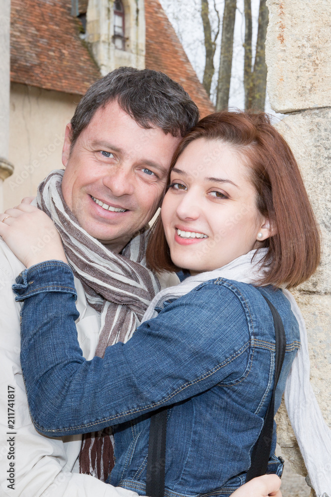 portrait of attractive happy couple outdoor during vacations portrait of attractive happy couple outdoor during vacations