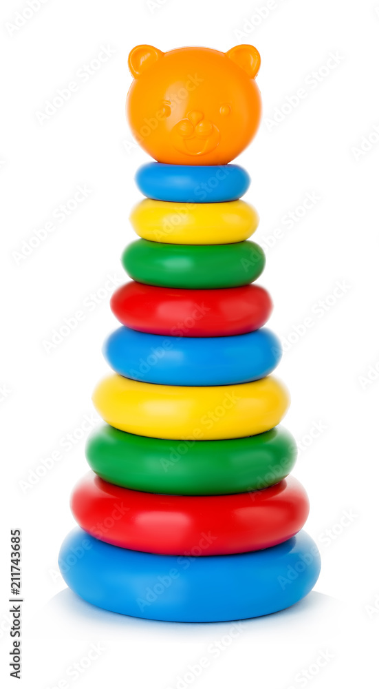 Children's pyramid isolated on white background. Multicolored children's educational toys. Children's pyramid isolated on white background. Multicolored children's educational toys.