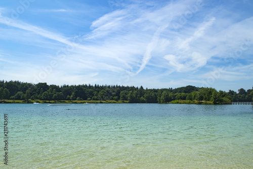 An azure water in forest lake. Summer landscape