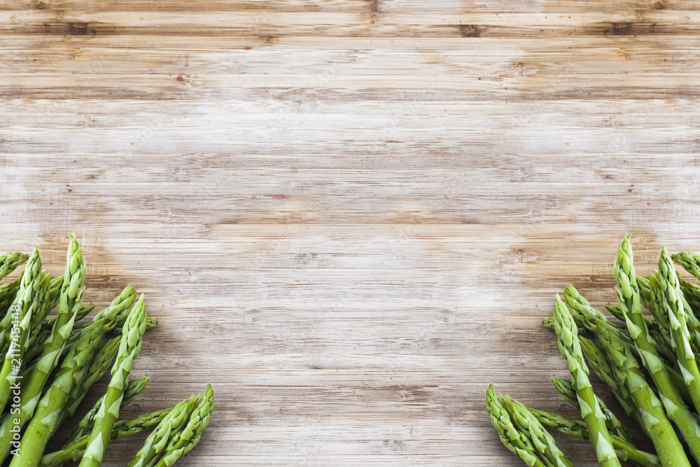 bunch of green asparagus on wooden board with copy space bunch of green asparagus on wooden board with copy space