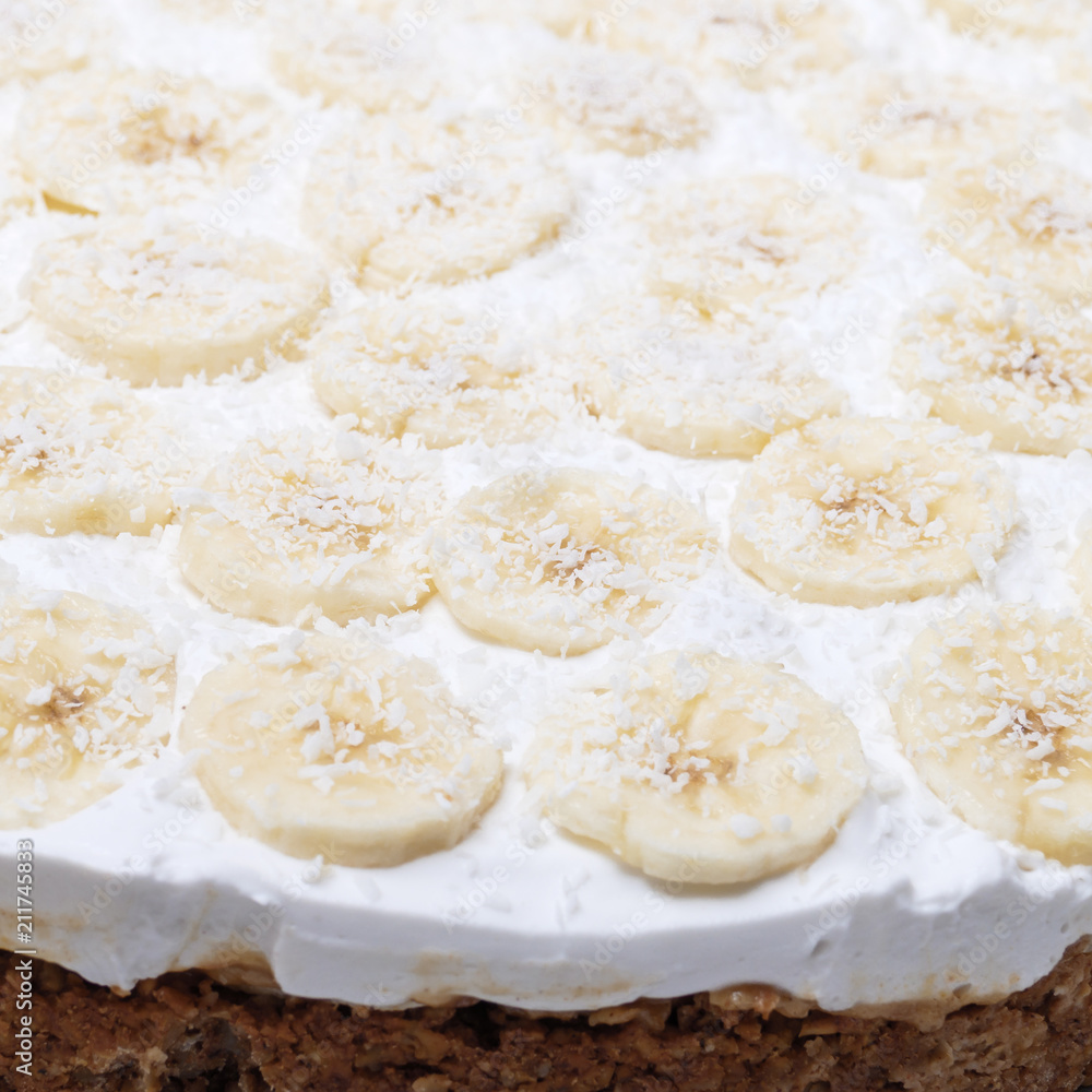 Vegan banoffee pie made from oats, dates, bananas and coconut cream, closeup view