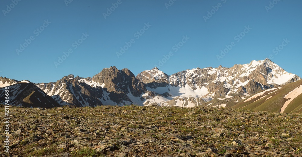 mountain tops with the remains of snow landscape background
