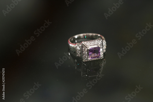 Purple gemstone on diamond ring © Bordin