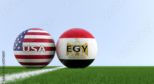 Egypt vs. USA Soccer Match - Soccer balls in Egypt and USA national colors on a soccer field. Copy space on the right side - 3D Rendering 