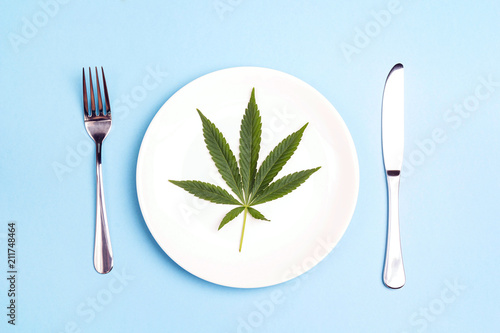 Medical concept table setting with cannabis leaf .