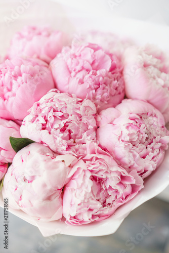 Lovely flowers in glass vase. Beautiful bouquet of pink peonies . Floral composition. Wallpaper