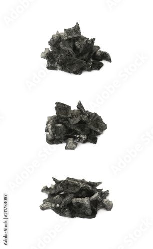 Pile of black salt crystals isolated