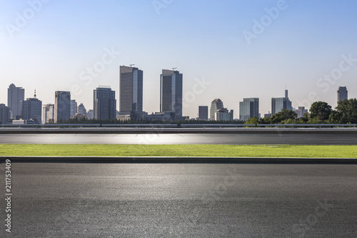 Modern business office buildings with empty road empty concrete square floor
