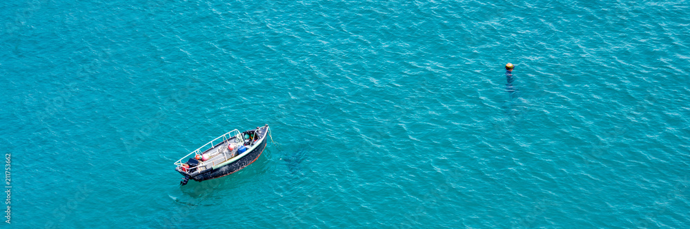 Small boat on the sea, panoramic aerial view,  in Guernsey