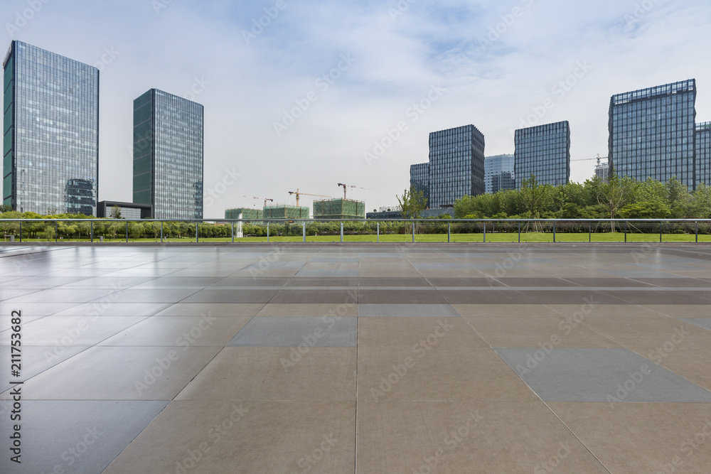 Modern business office buildings with empty road,empty concrete square floor