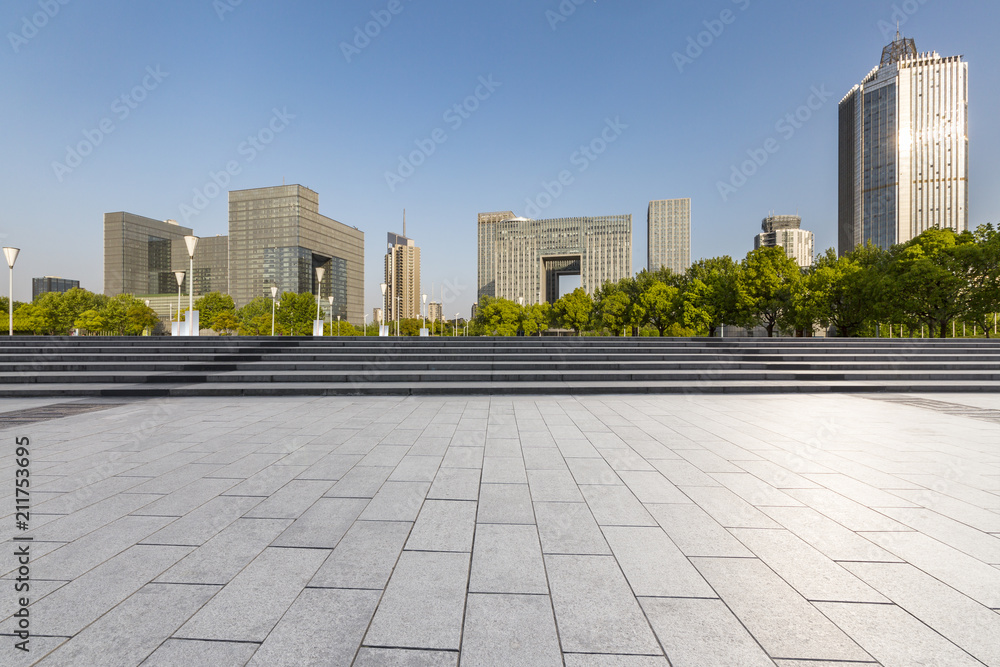 Modern business office buildings with empty road,empty concrete square floor Modern business office buildings with empty road,empty concrete square floor