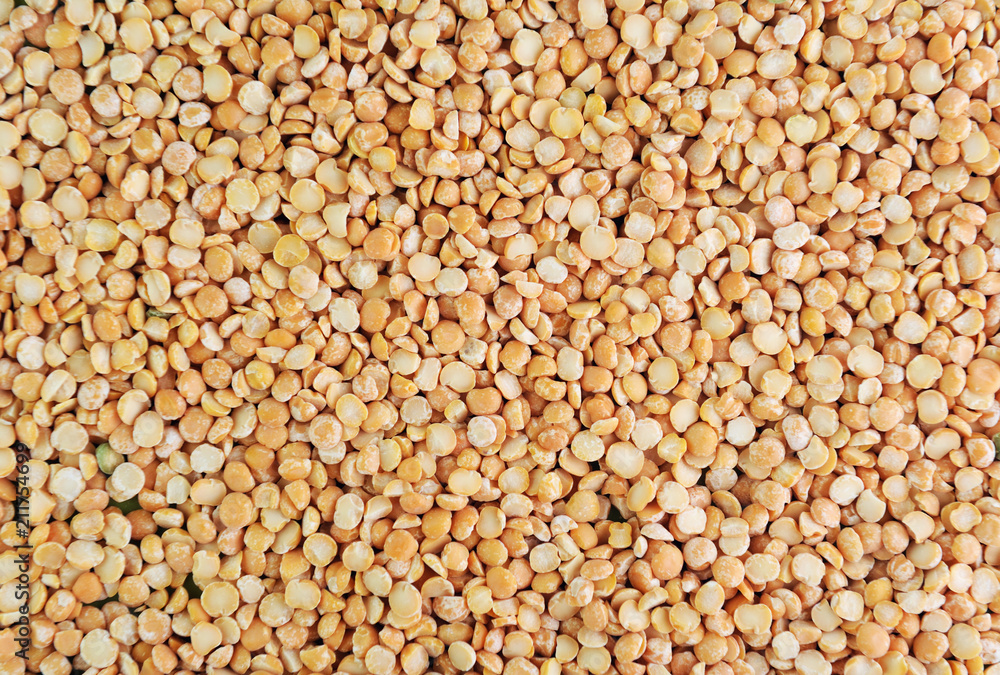 Yellow split peas (cereals).Dry yellow split peas background texture, vegetable protein source fo vegetarians and vegans Yellow split peas (cereals).Dry yellow split peas background texture, vegetable protein source fo vegetarians and vegans