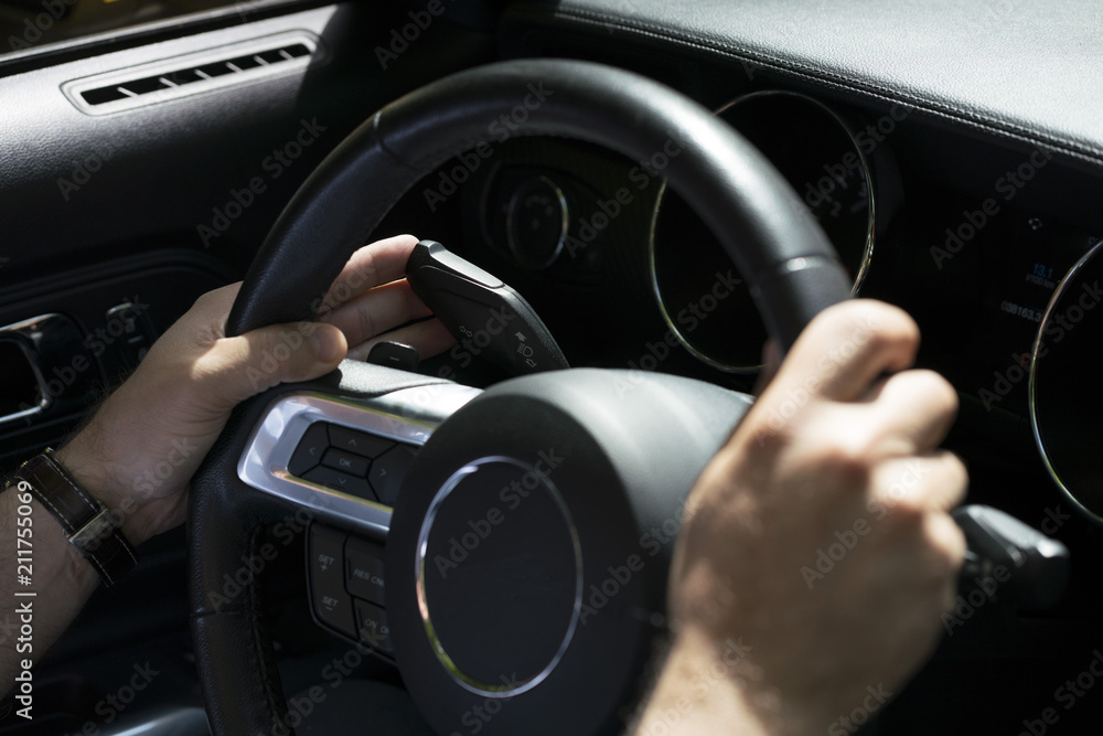Crop man pushing handle of signal light