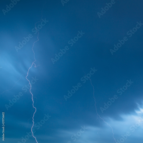 The discharge of lightning in the sky as a background