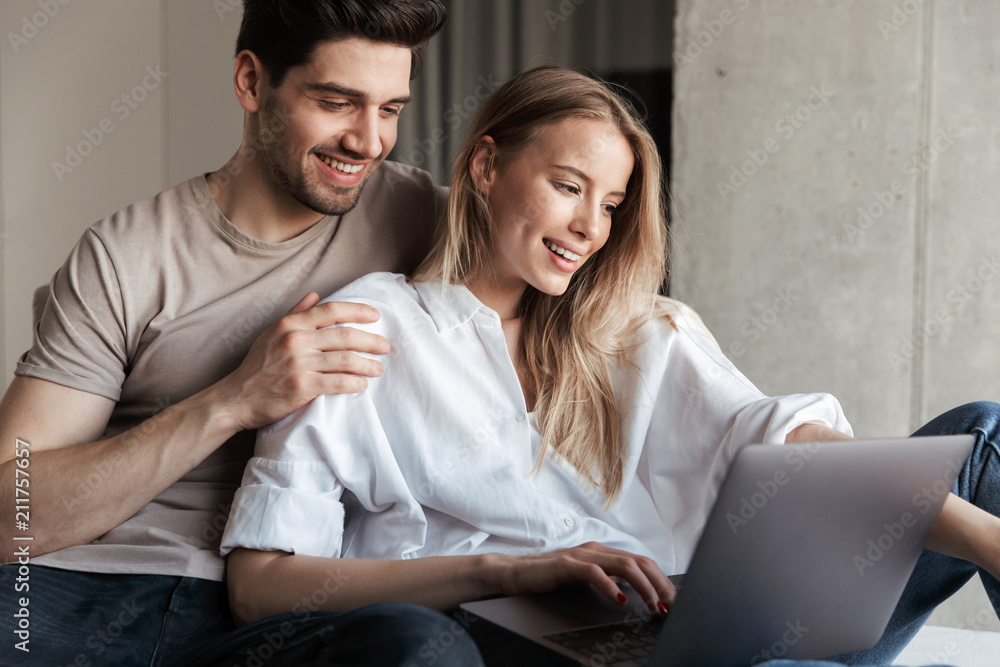Young cute happy loving couple in home Young cute happy loving couple in home