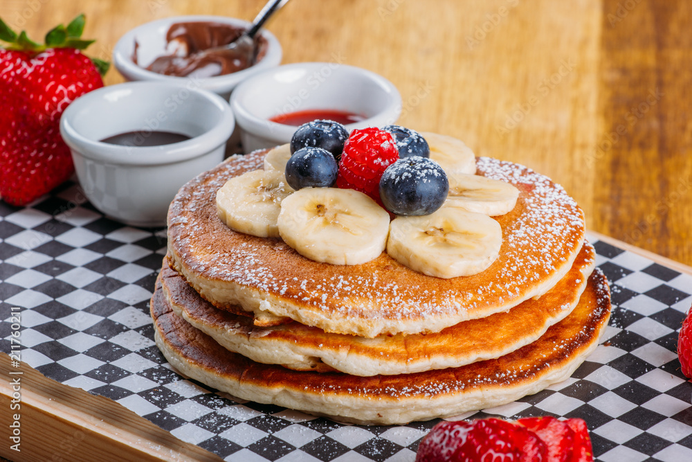 Fluffy pancakes with berries for breakfast Fluffy pancakes with berries for breakfast