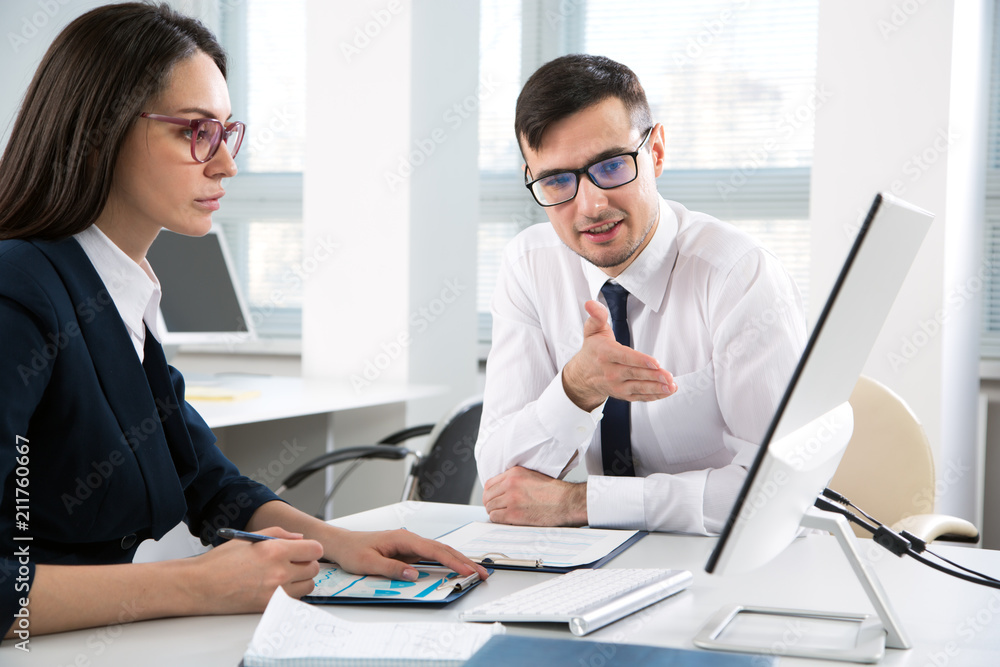 Businessman explains to colleague a new project Businessman explains to colleague a new project
